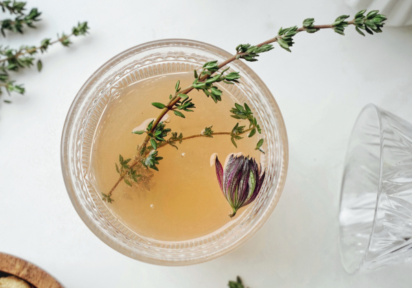 Herb-infused simple syrups in glass bottles