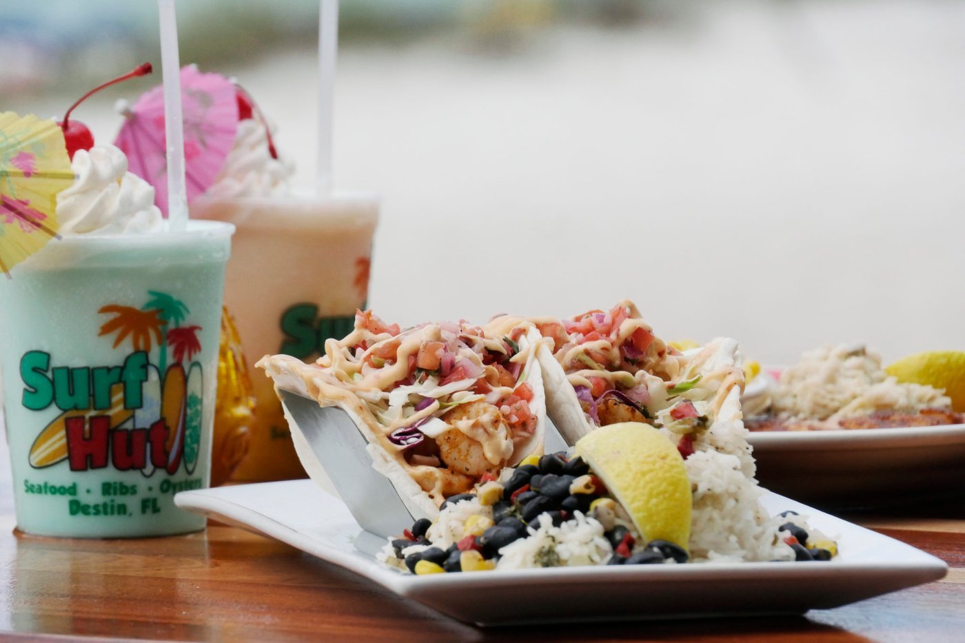 Tacos and drinks at Surf Hut beachfront restaurant in Miramar Beach